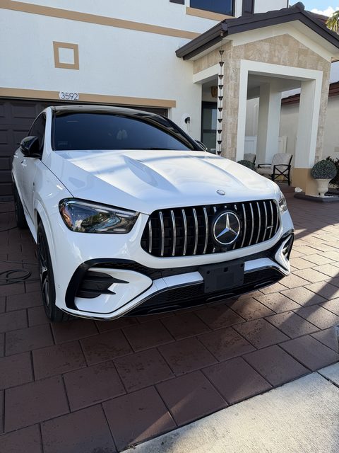 White Mercedes-AMG GLE coupe freshly detailed in the driveway