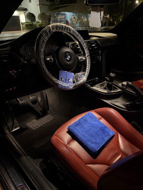 BMW M interior with red leather seats after detailing