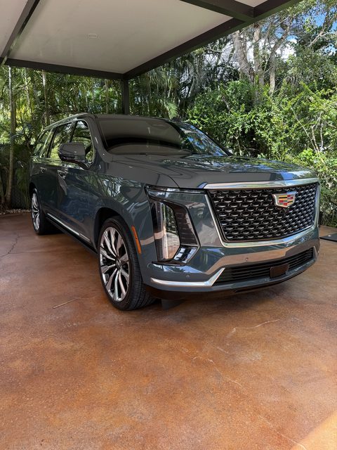 Cadillac Escalade freshly detailed under a carport