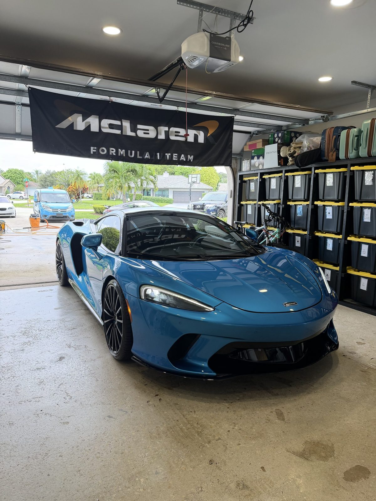 Blue McLaren GT detailed and parked in the garage