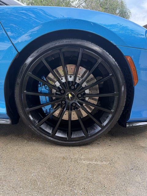 McLaren GT wheel and tire cleaned and dressed