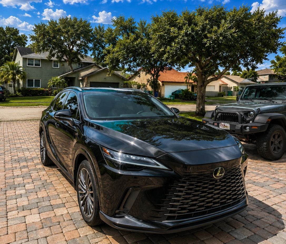 Black Lexus RX with a mirror finish after paint correction
